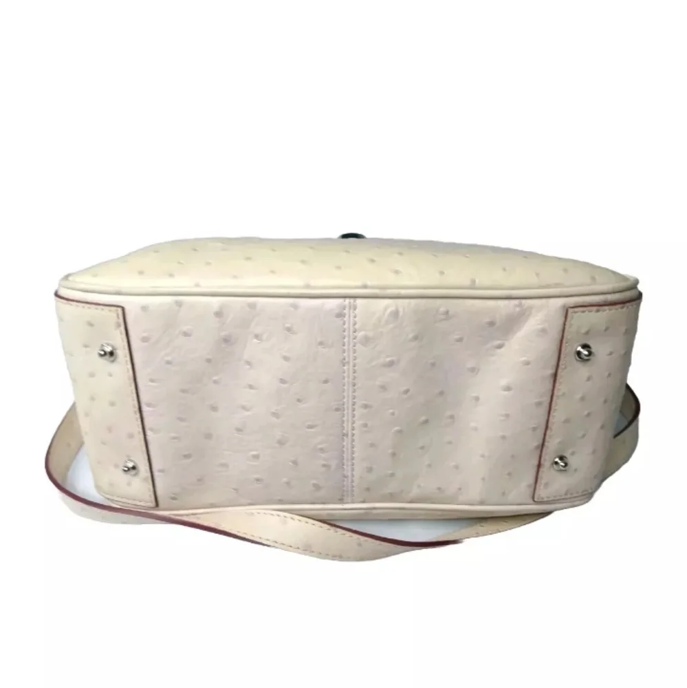Dooney & Bourke Butter Yellow Ostrich-Embossed Satchel with lilac dots
